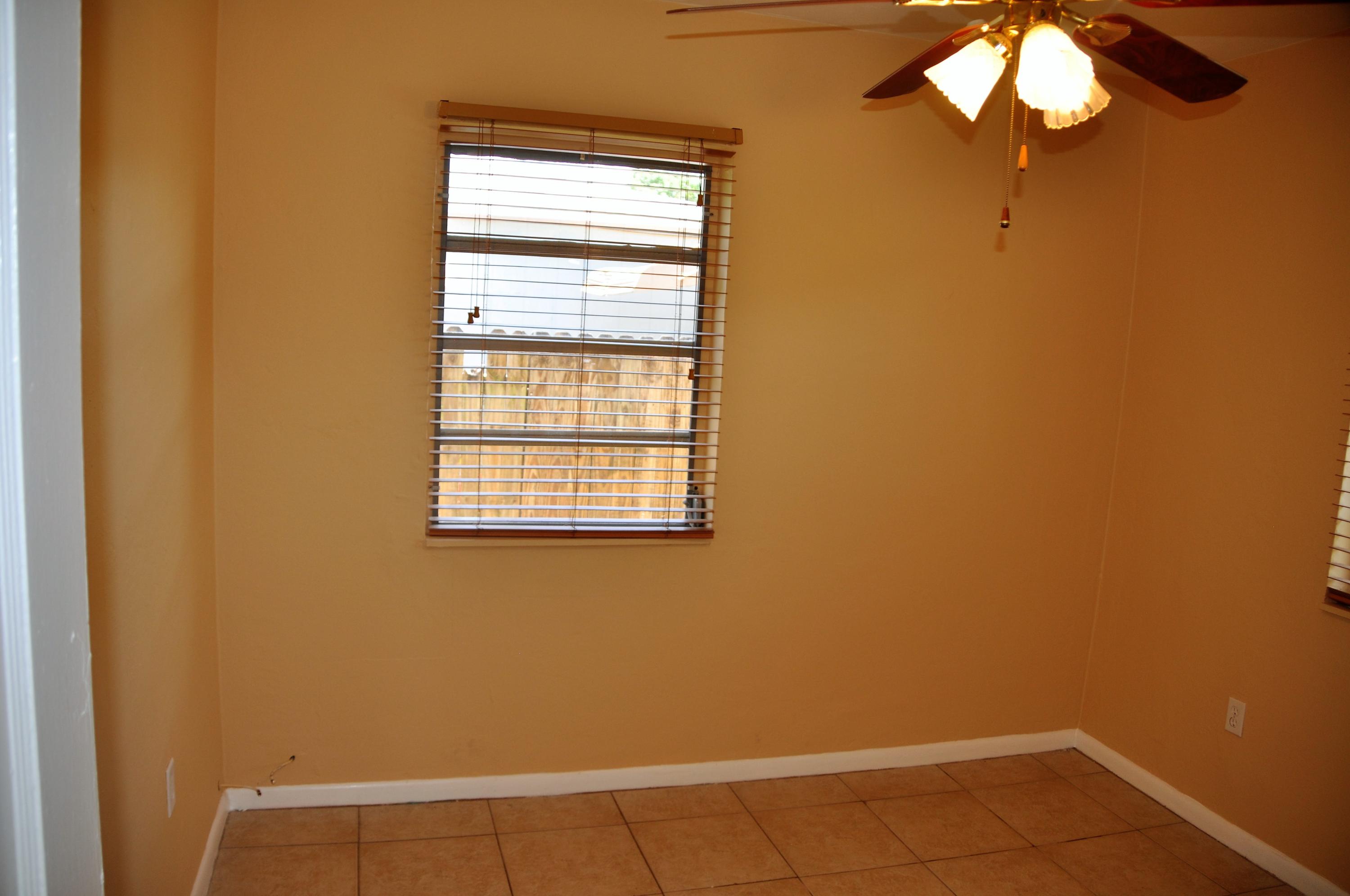 3025 Robert Road West Palm Beach, FL 33405 - Photo 27 of 41 an empty room with a window