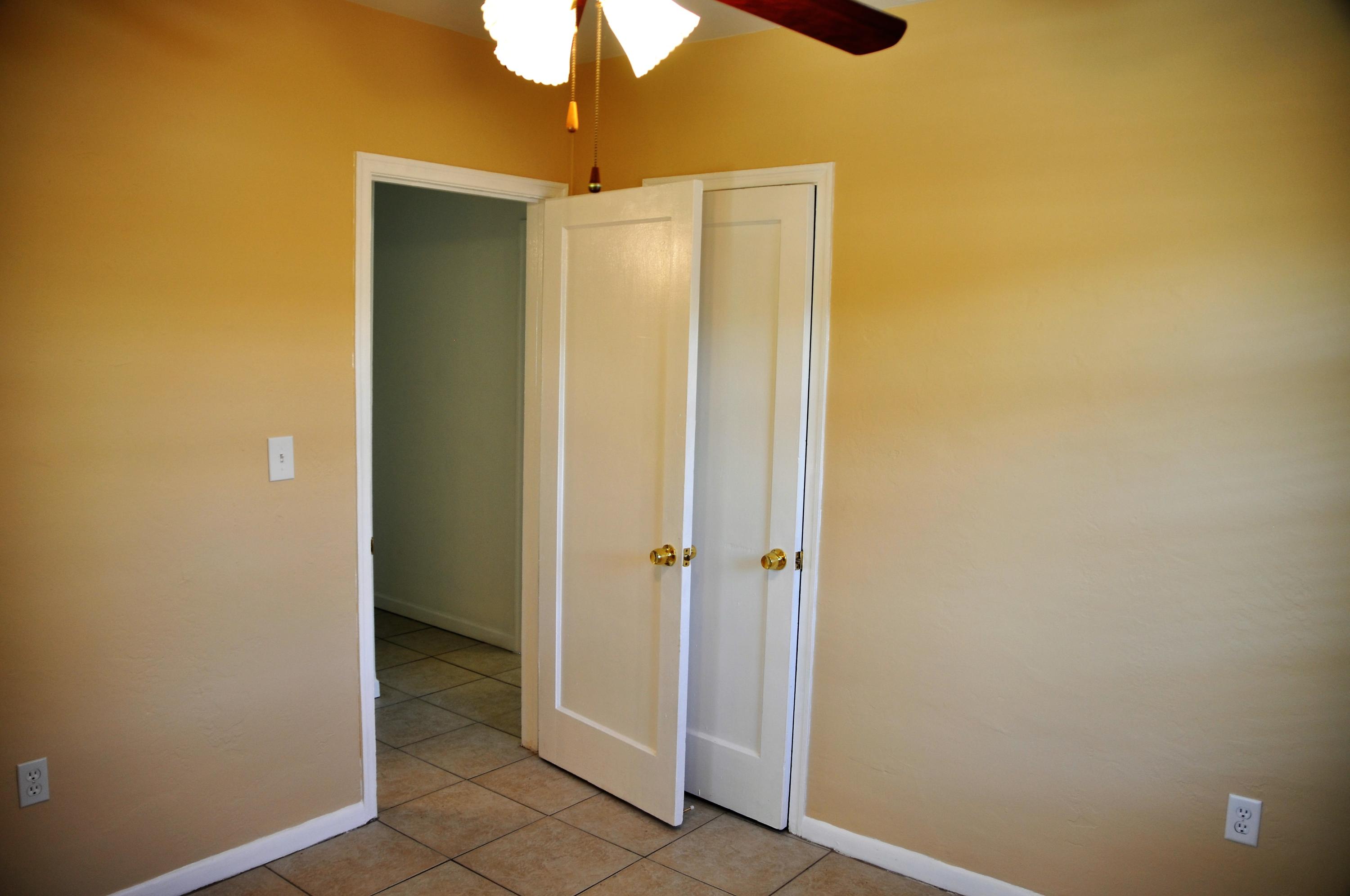 3025 Robert Road West Palm Beach, FL 33405 - Photo 29 of 41 a view of a hallway with a chandelier fan