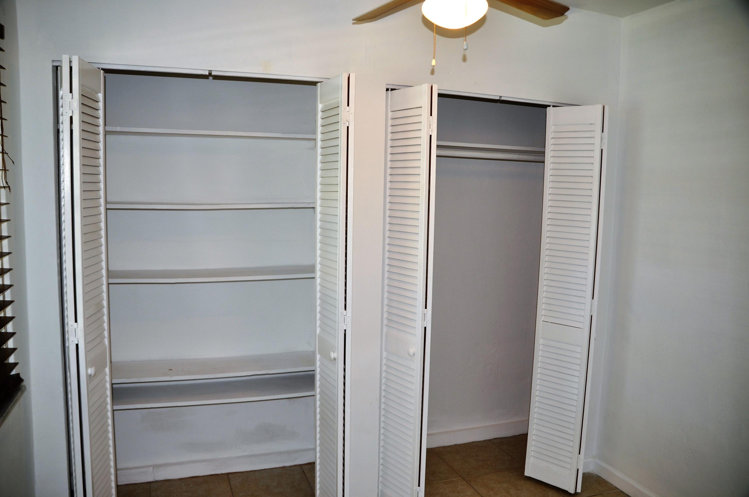 3025 Robert Road West Palm Beach, FL 33405 - Photo 33 of 41 a view of walk in closet with empty racks