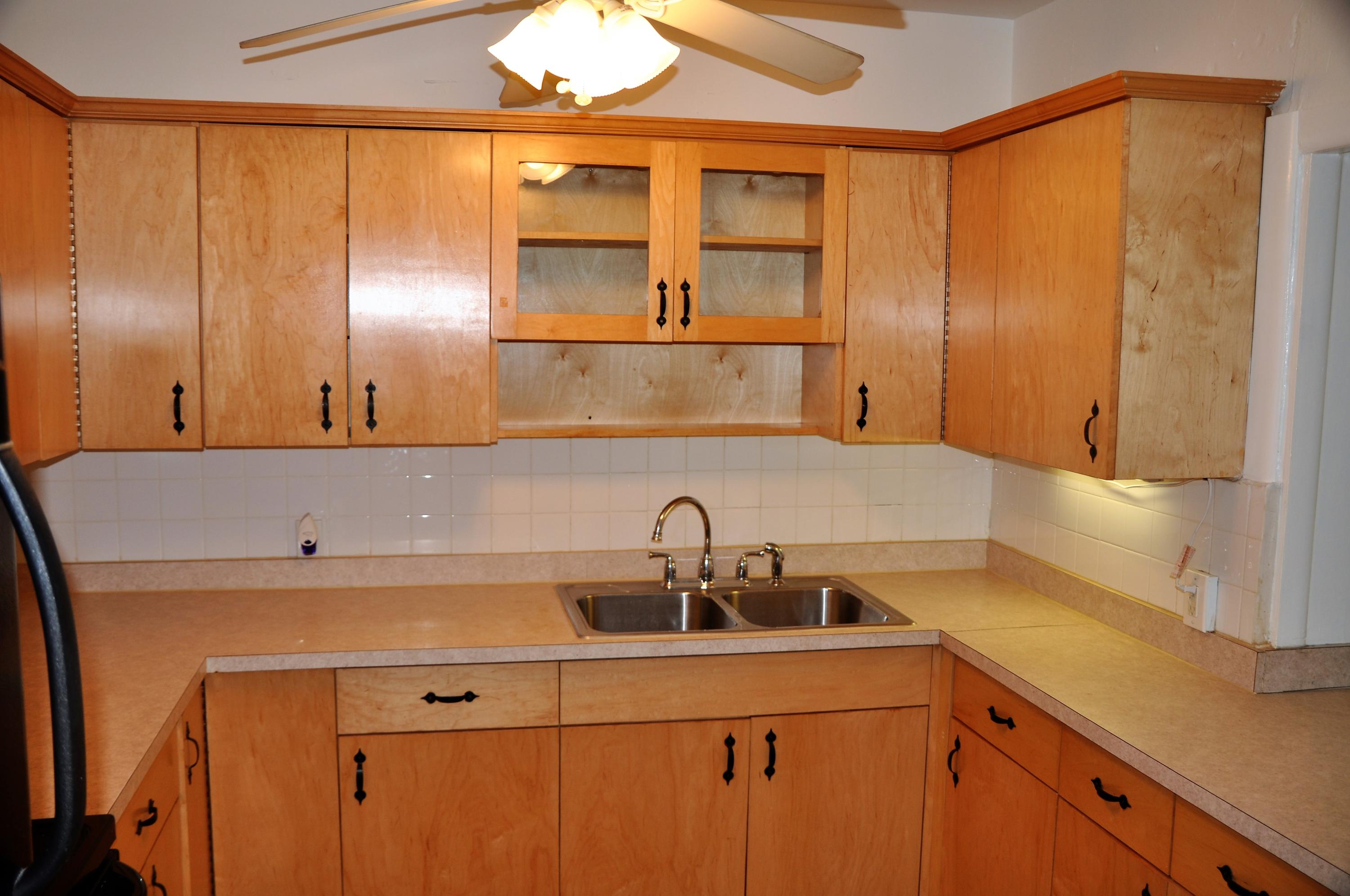 3025 Robert Road West Palm Beach, FL 33405 - Photo 5 of 41 a kitchen with a sink and a large mirror