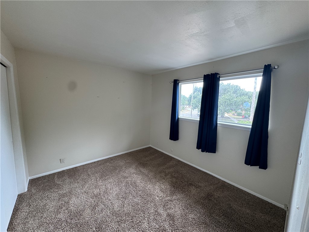 1915 Hidden Way Corpus Christi, TX 78412 - Photo 7 of 11 an empty room with windows