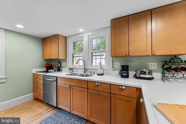 a kitchen with a refrigerator stove and microwave
