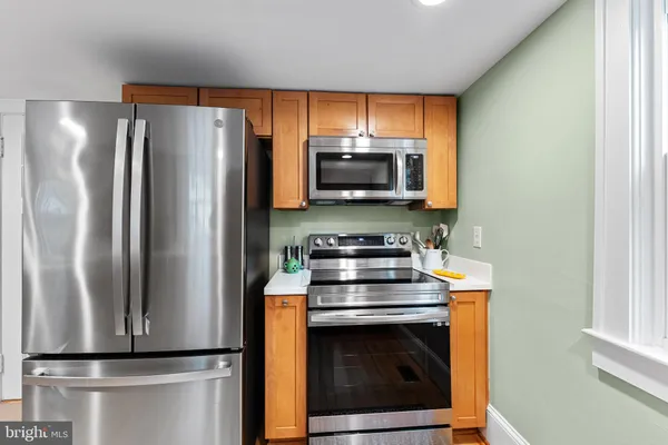 a room with a washing machine and a fireplace