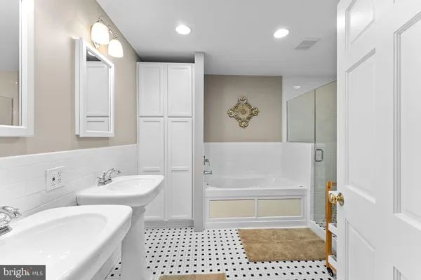 a bathroom with a bathtub and a shower