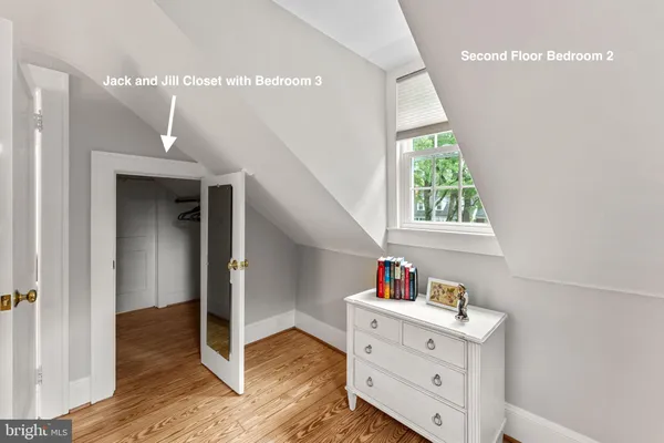 a view of a room with wooden floor and staircase