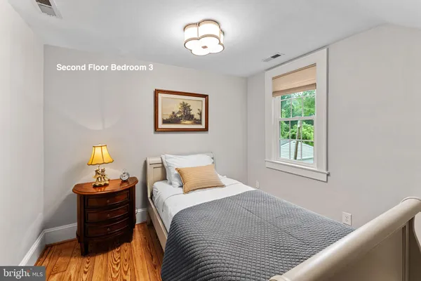 a bathroom with a sink mirror and toilet