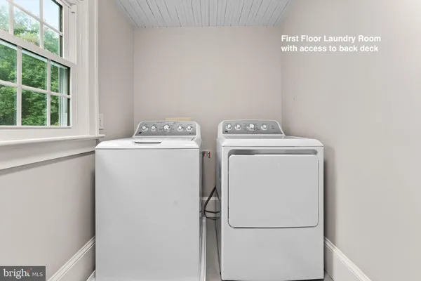 a view of a chair and table on the deck