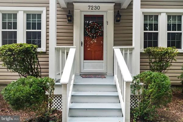 a view of front door and potted plants