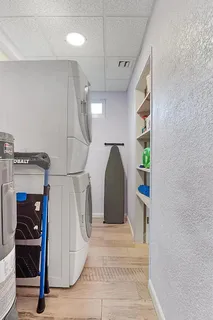 a patio with couches table and chairs with wooden floor