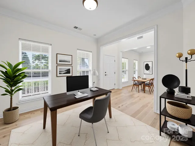 a view of a livingroom with furniture and a window
