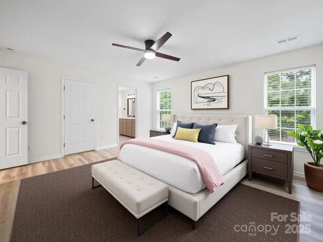 a spacious bedroom with a bed and window