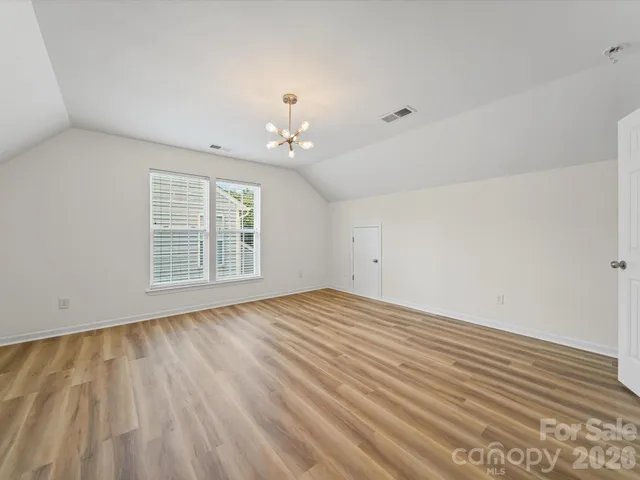 a view of house with a big yard