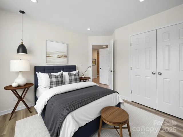 a bedroom with a bed and a chair