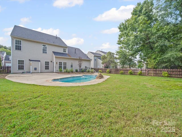 a view of field with trees in the background