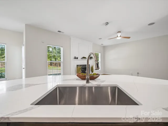 a kitchen with a sink and a window
