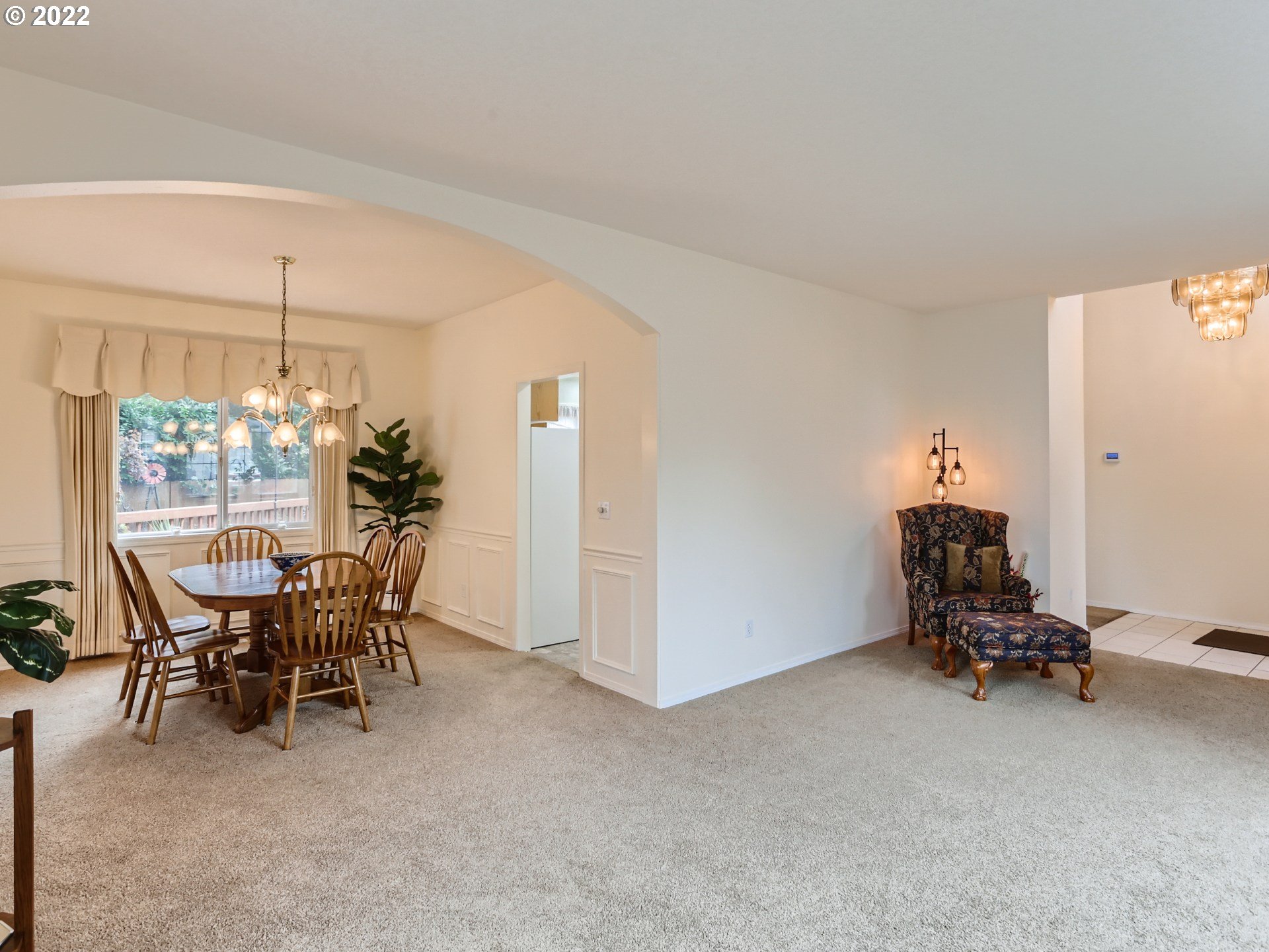 11370 Southwest Clifford Street Beaverton, OR 97008 - Photo 7 of 29 a view of a dining room with furniture and chandelier