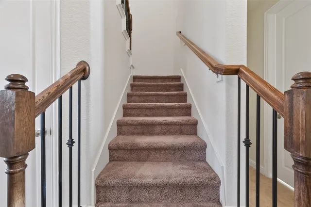 a view of a livingroom with workspace and a window