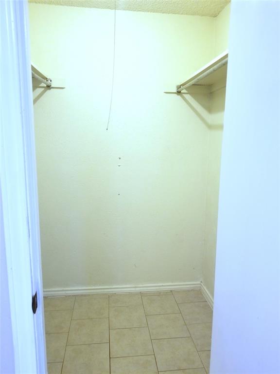 407 Gatewood Road, Unit 407 Garland, TX 75043 - Photo 4 of 6 Walkin closet in Primary Bedroom