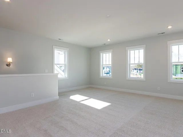 a view of empty room with windows