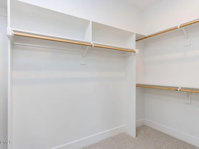 a view of an empty walk in closet