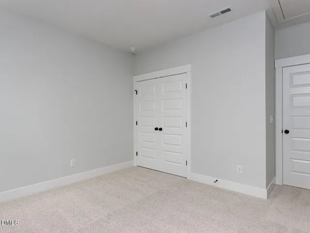 a bathroom with a sink toilet vanity and shower