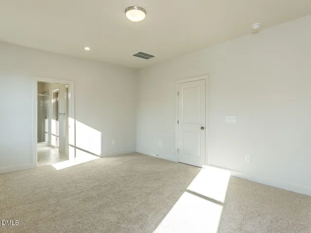 a bathroom with a shower sink and mirror