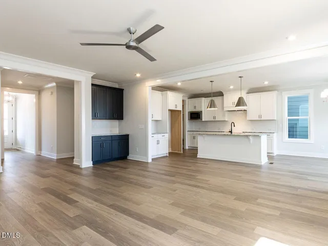 a view of a kitchen with a stove cabinets and wooden floor