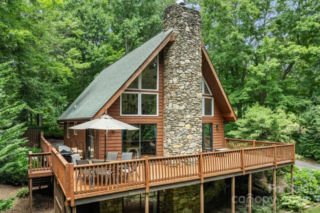 a view of a wooden deck with a trees