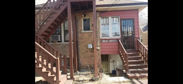a view of a brick building with many windows
