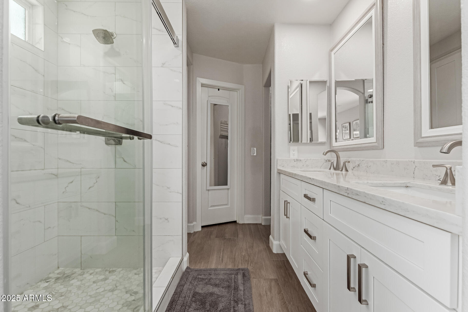 92 West Jasper Drive Gilbert, AZ 85233 - Photo 16 of 34 a bathroom with a granite countertop sink a mirror and a shower