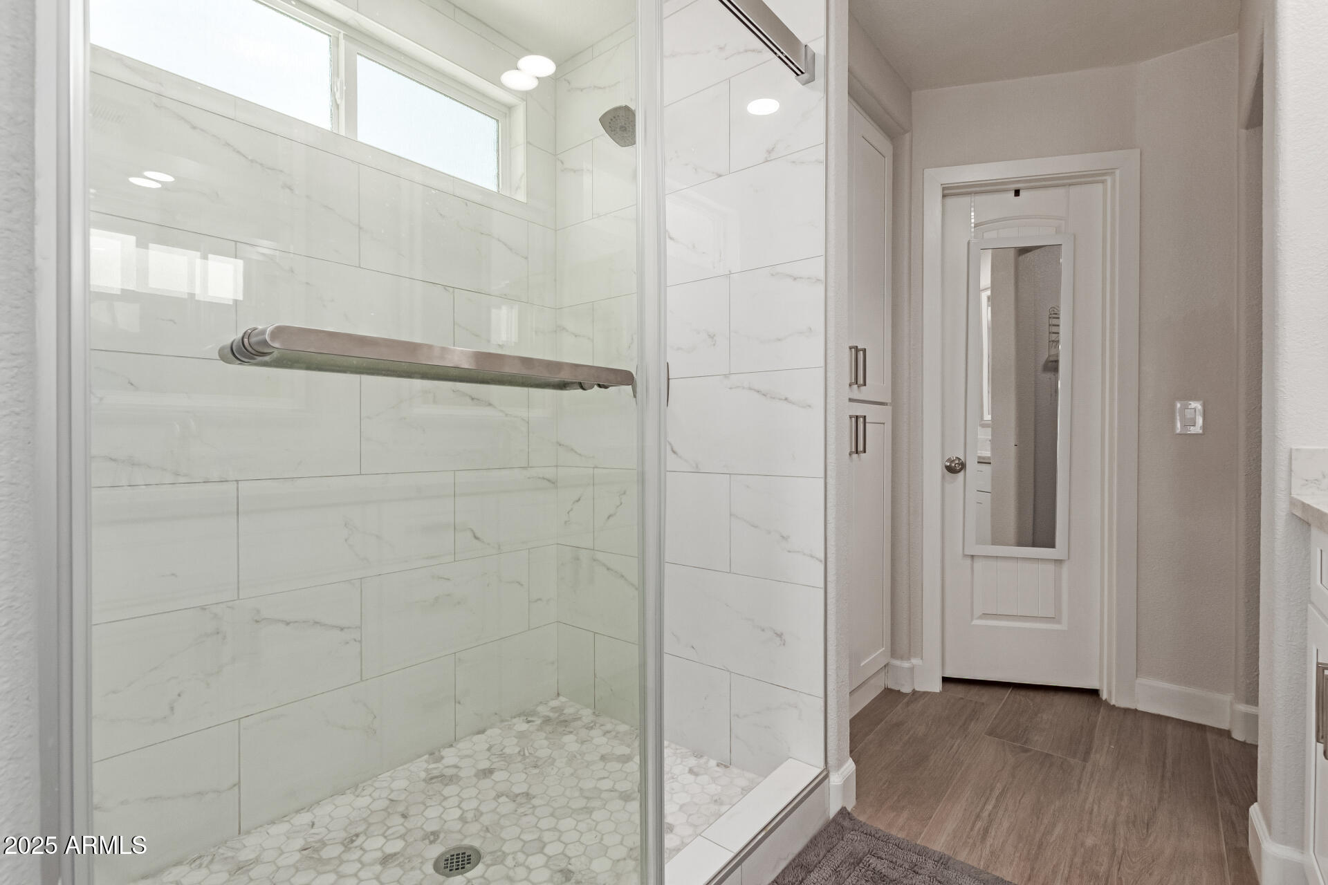 92 West Jasper Drive Gilbert, AZ 85233 - Photo 18 of 34 a bathroom with a glass shower door