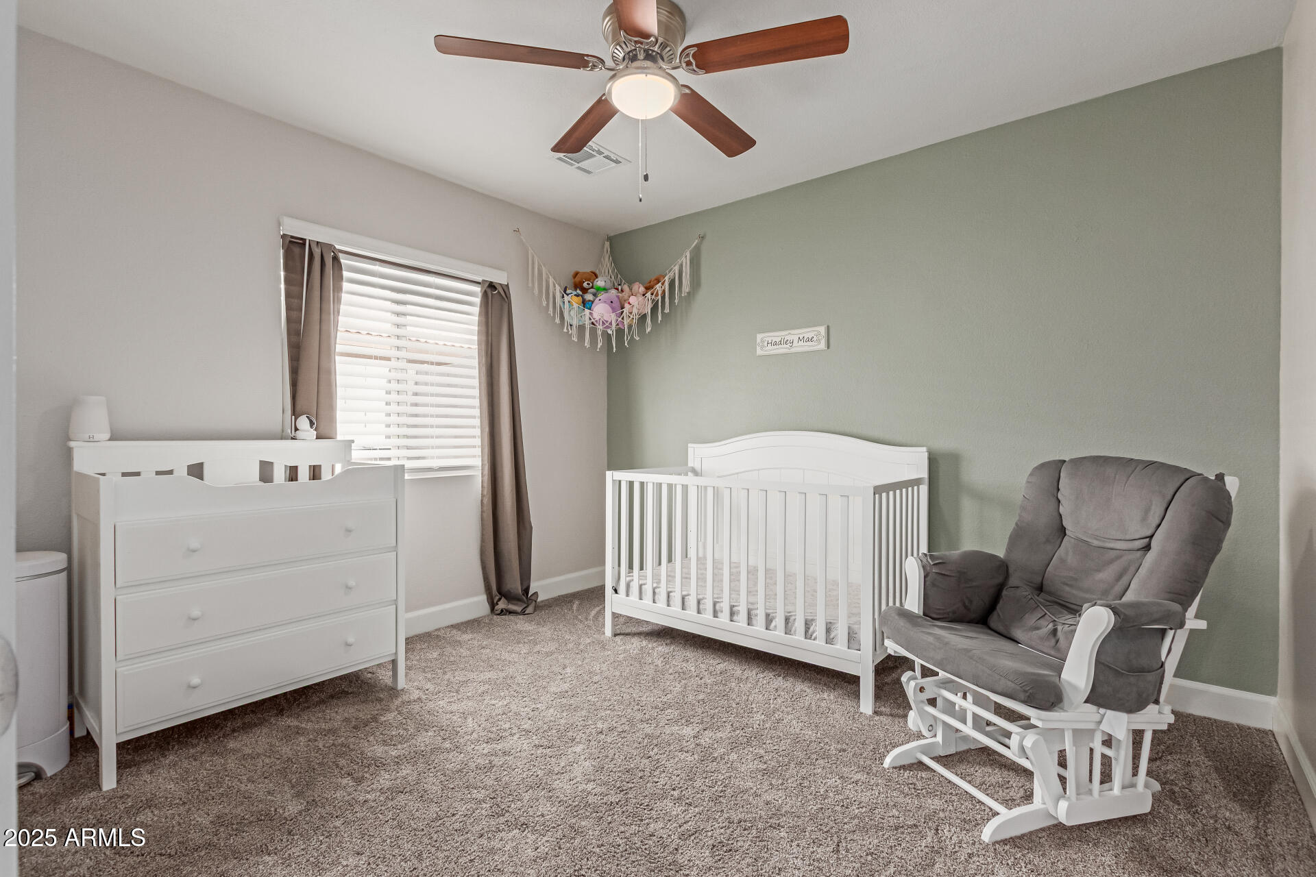 92 West Jasper Drive Gilbert, AZ 85233 - Photo 19 of 34 a bedroom with a baby bed chair and a window