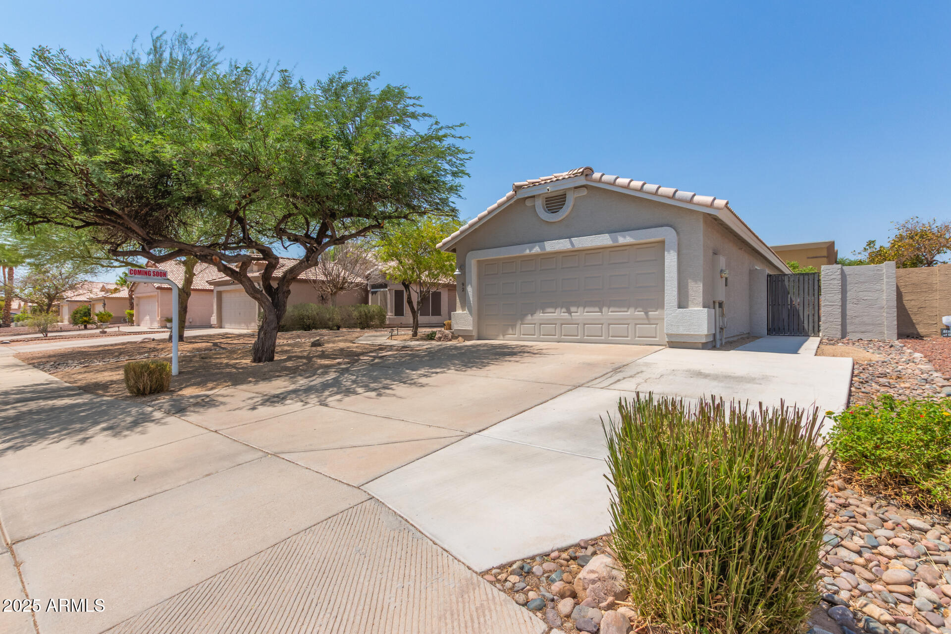 92 West Jasper Drive Gilbert, AZ 85233 - Photo 2 of 34 a front view of a house with a yard and garage