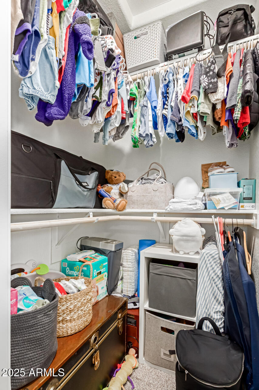 92 West Jasper Drive Gilbert, AZ 85233 - Photo 24 of 34 a store room with lots of different colored cloths