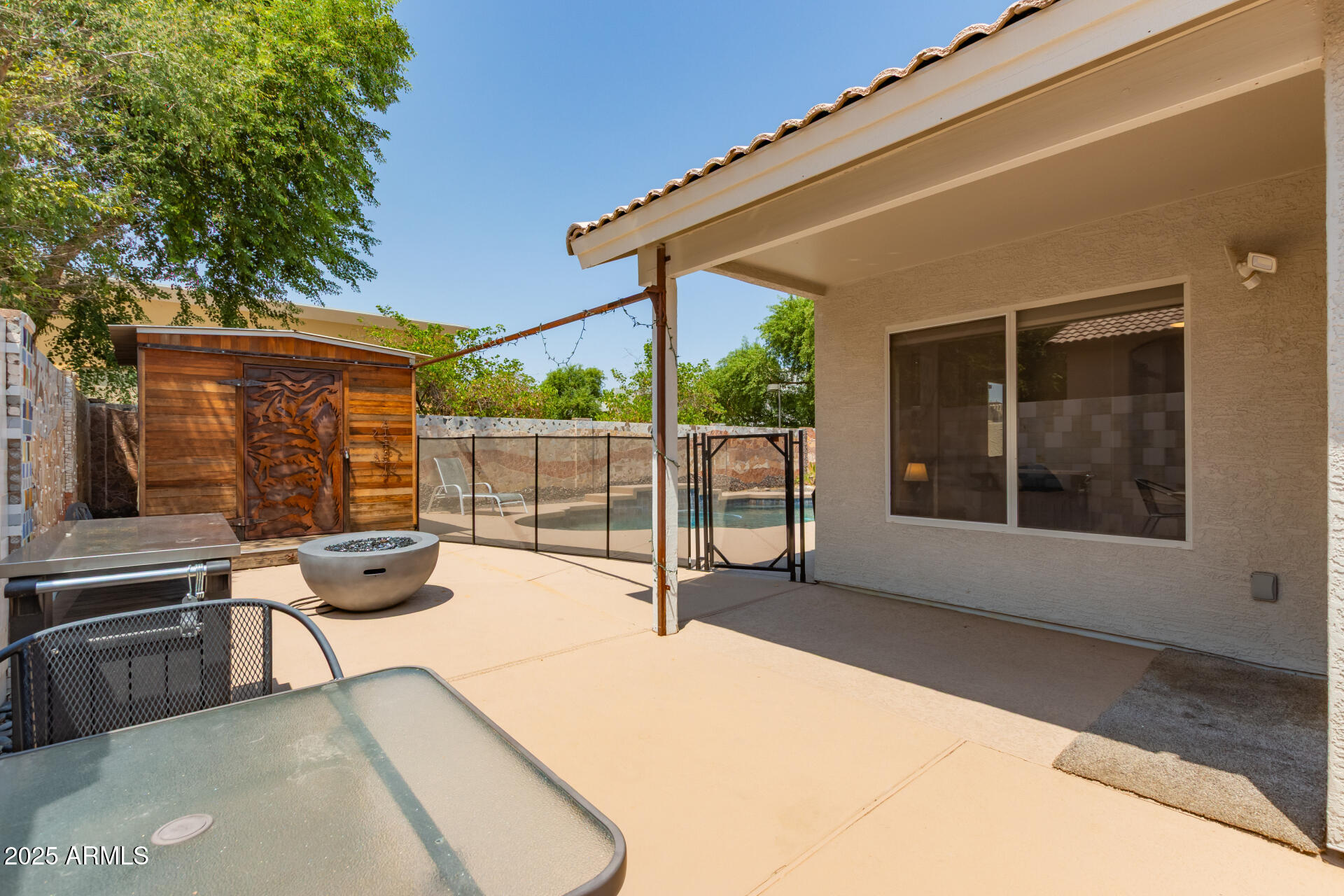 92 West Jasper Drive Gilbert, AZ 85233 - Photo 25 of 34 a view of a backyard with a large window and balcony
