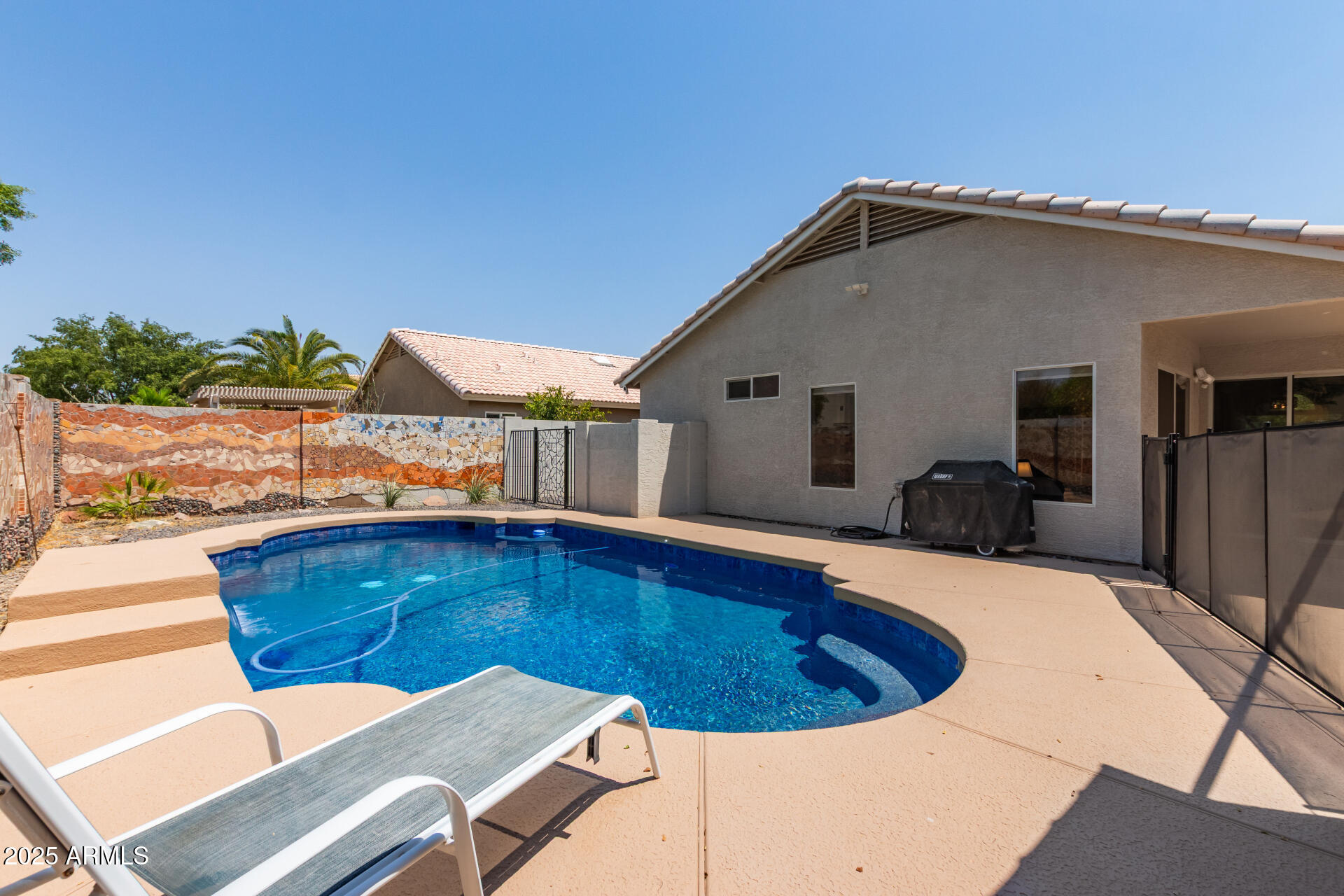 92 West Jasper Drive Gilbert, AZ 85233 - Photo 27 of 34 a view of outdoor space with swimming pool and furniture