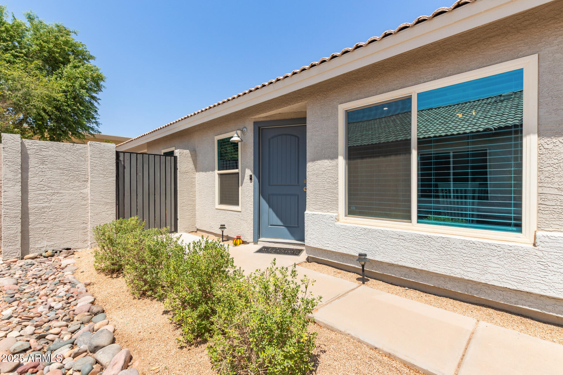 92 West Jasper Drive Gilbert, AZ 85233 - Photo 33 of 34 a front view of a house with a yard