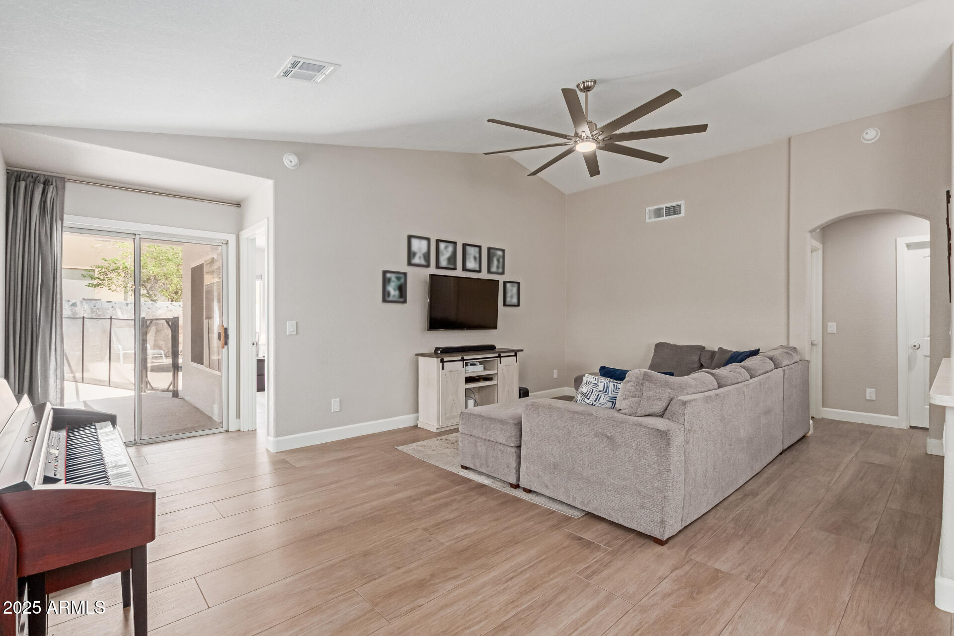 92 West Jasper Drive Gilbert, AZ 85233 - Photo 5 of 34 a living room with furniture wooden floor and a flat screen tv