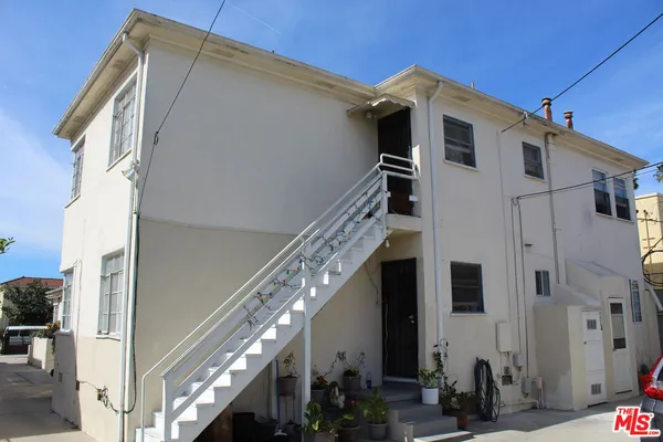 a view of a house with a street