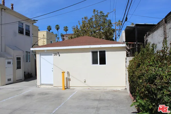 a front view of a house with an outdoor space