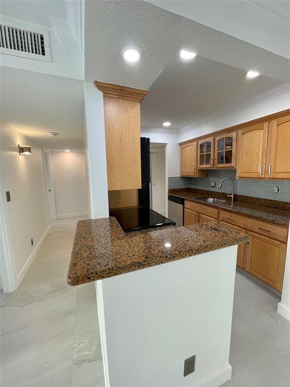 1515 East Broward Boulevard, Unit 124 Fort Lauderdale, FL 33301 - Photo 12 of 12 a kitchen with stainless steel appliances granite countertop a sink a stove and a refrigerator