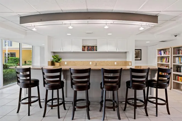 a room with lots of table and chairs