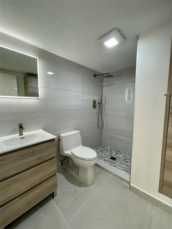 1515 East Broward Boulevard, Unit 124 Fort Lauderdale, FL 33301 - Photo 8 of 12 a bathroom with a sink a toilet and shower