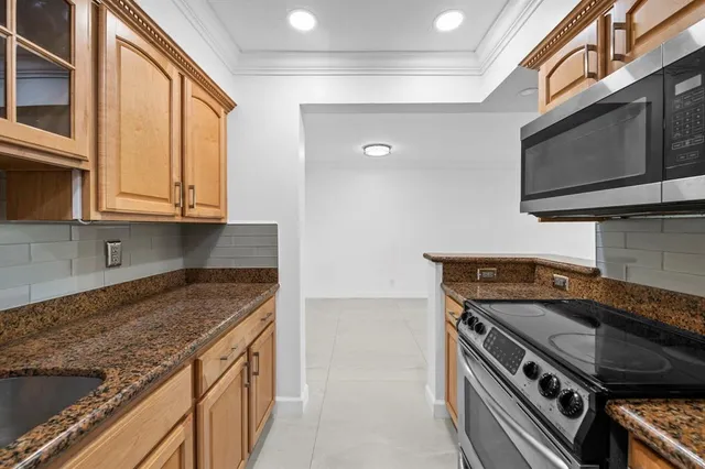 a kitchen with a stove and a microwave
