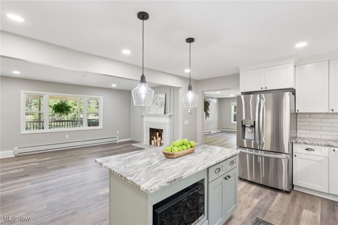 8015 Fairmount Road Novelty, OH 44072 - Photo 50 of 50 Kitchen featuring stainless steel appliances, open floor plan, and decorative light fixtures