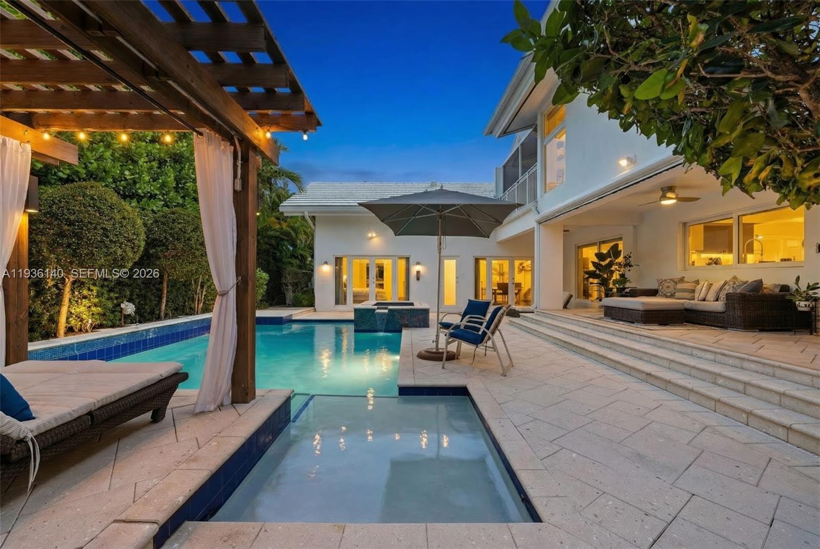 a view of a patio with dining table and chairs with a couches near a patio
