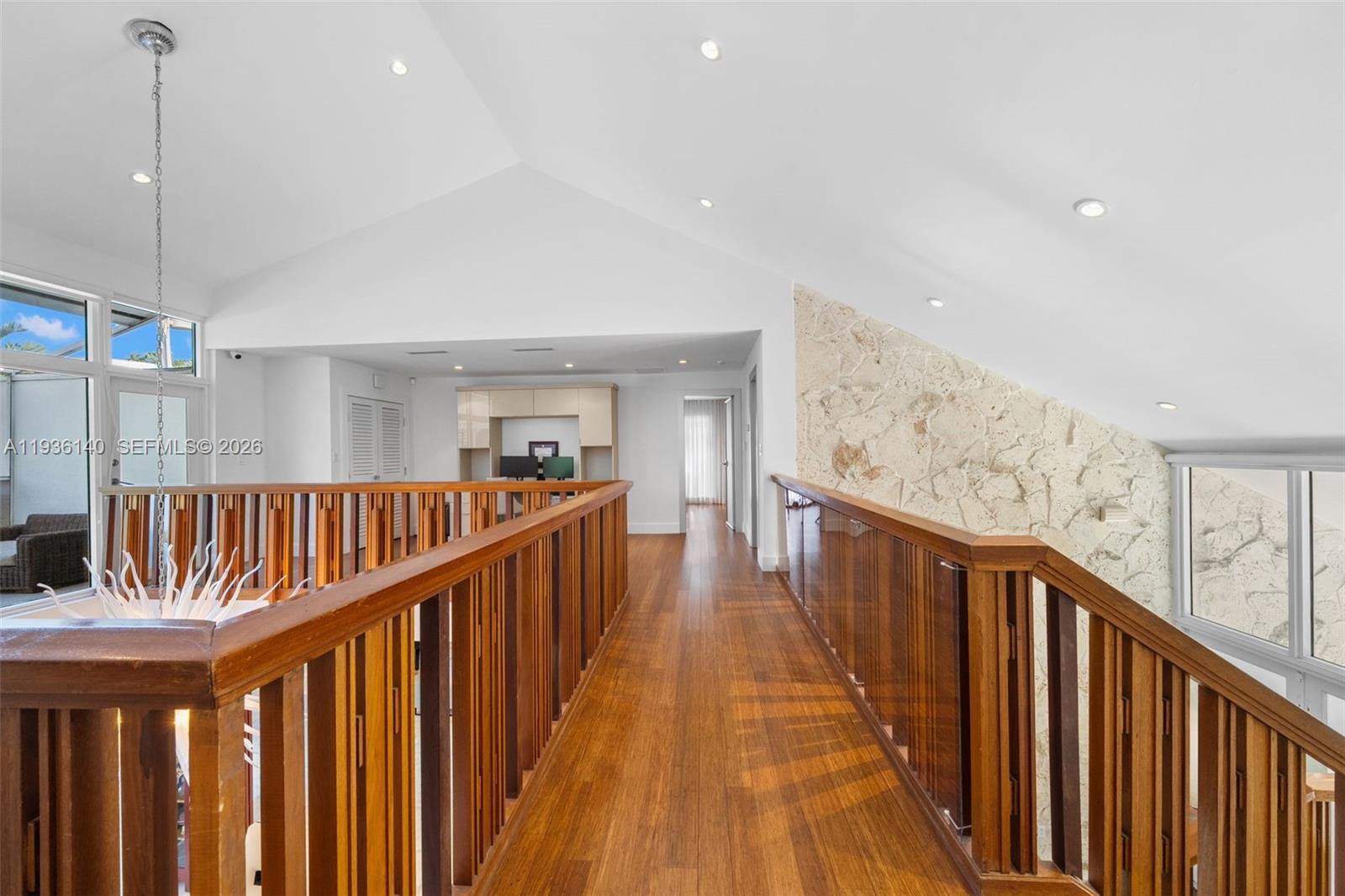 1251 Kane Concourse Bay Harbor Islands, FL 33154 - Photo 26 of 52 a view of staircase with wooden floor and fan