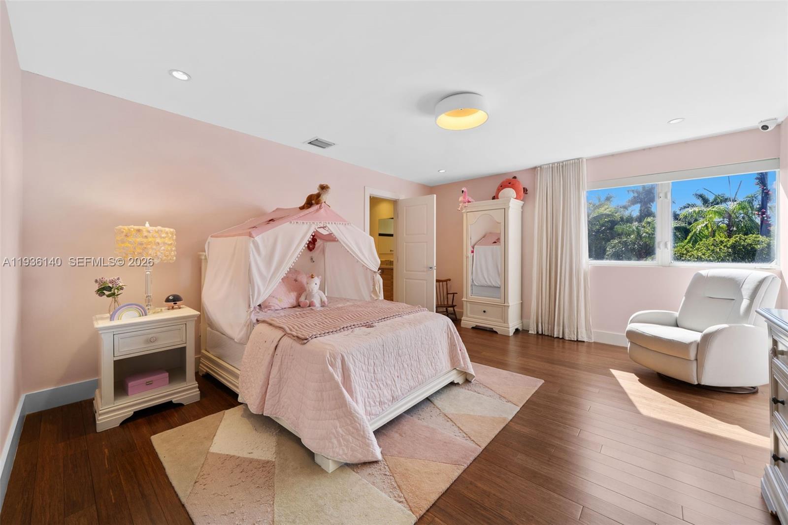 1251 Kane Concourse Bay Harbor Islands, FL 33154 - Photo 30 of 52 a bedroom with a bed and a couch