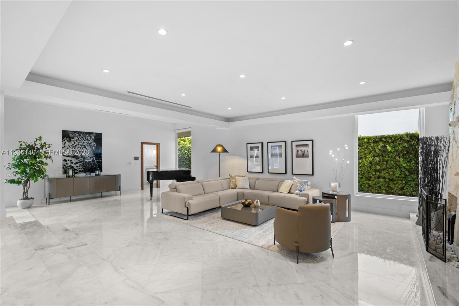 1251 Kane Concourse Bay Harbor Islands, FL 33154 - Photo 3 of 52 a living room with furniture and a large window