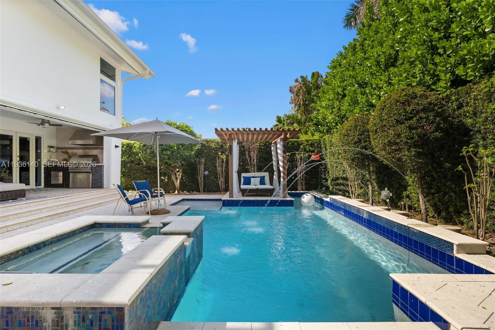 1251 Kane Concourse Bay Harbor Islands, FL 33154 - Photo 42 of 52 a view of a house with a yard patio and a patio